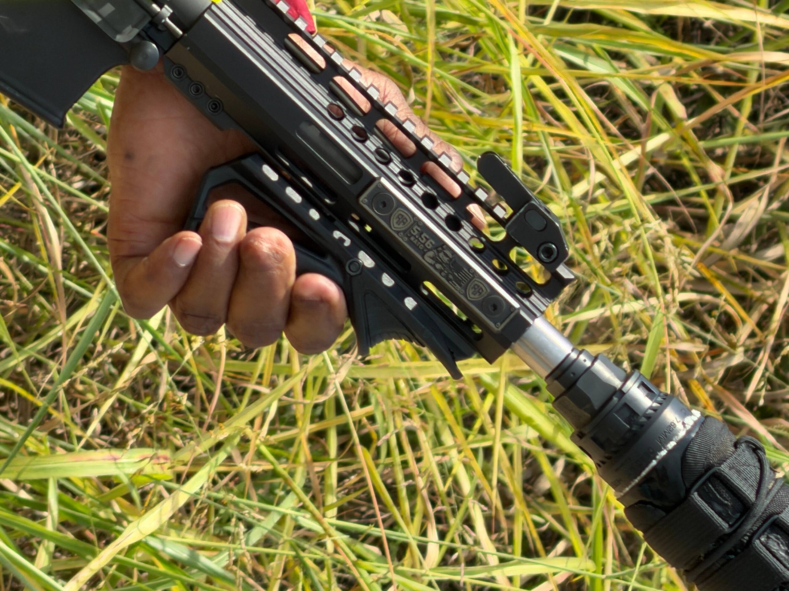 Rail Armor 5.56 NATO M-LOK rail cover installed on AR-15 handguard — close-up of engraving